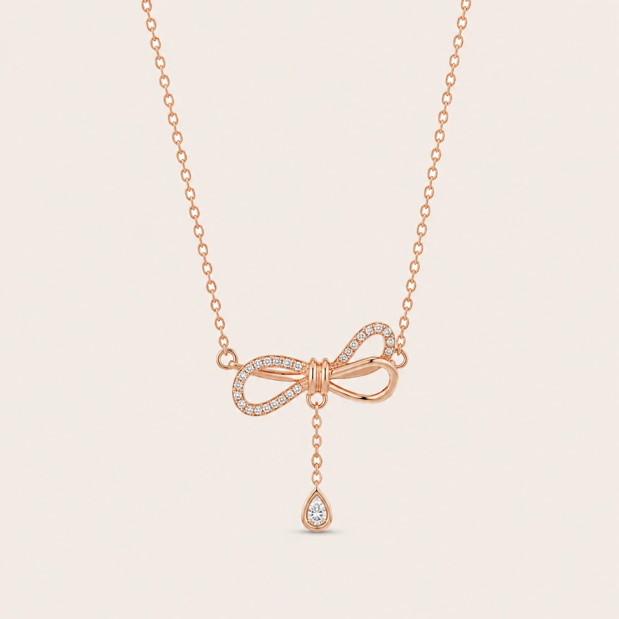 Divayra Zircon Embedded Rose Gold Bow & Teardrop Necklace