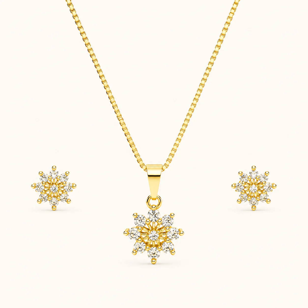 Aurora Bloom Jewelry Set featuring a polished gold pendant necklace and matching stud earrings with sparkling round-cut crystal snowflake design
