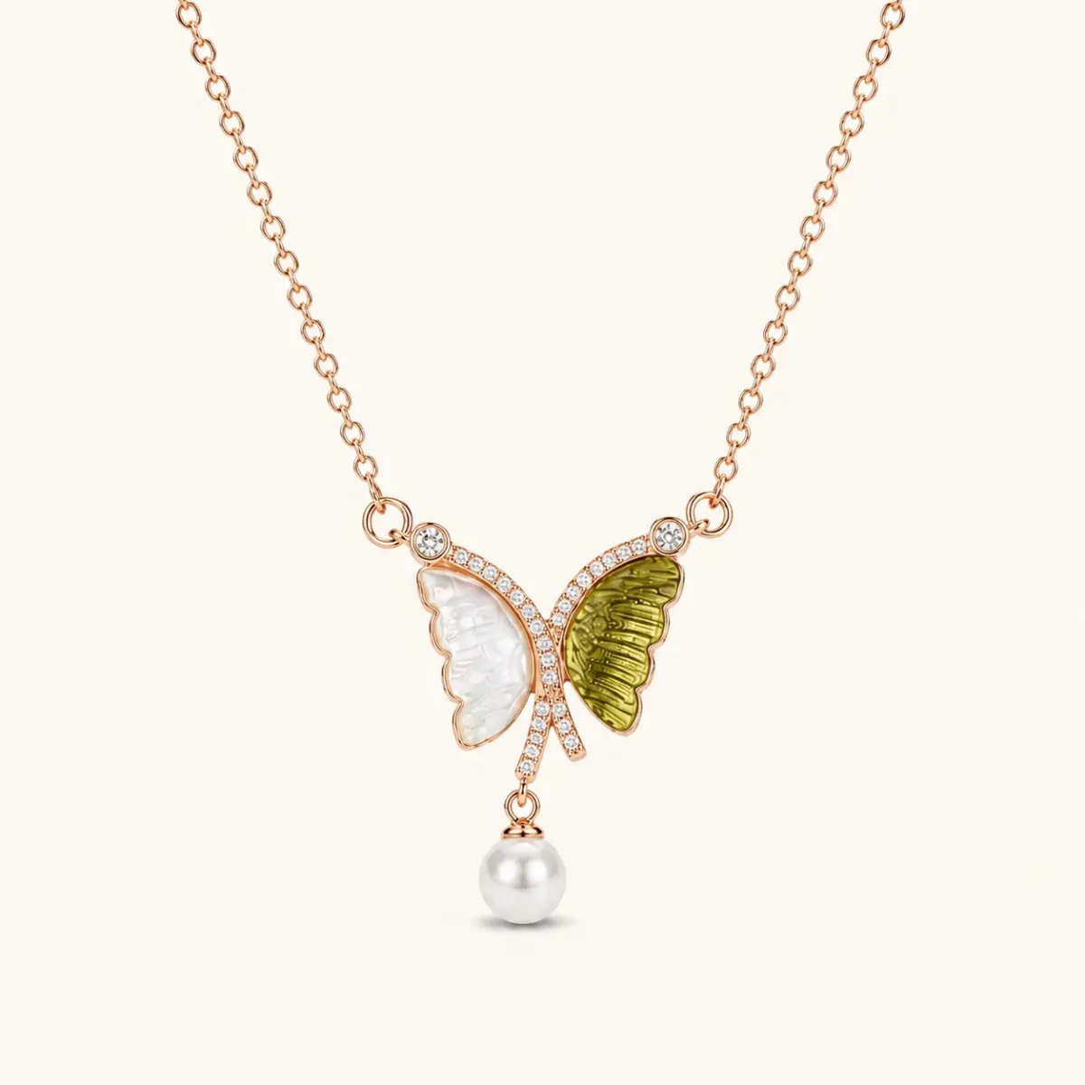 Butterfly Pearl Gold Necklace with white and green enamel wings, sparkling stones, and dangling pearl in rose gold finish