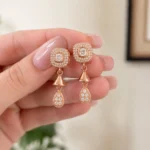 Divayra Rose gold halo drop earrings with cushion cut cubic zirconia and pavé teardrop charm for women