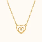Double Heart Gold Pendant necklace featuring interlocking heart shapes with a sparkling center stone in yellow gold