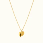 Dual Finish Heart Pendant Necklace featuring a polished gold heart and textured gold heart design on a delicate chain