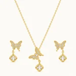 FlutterAura Butterfly Jewelry Set with sparkling butterfly pendant, geometric crystal drop, matching butterfly earrings, and polished gold finish