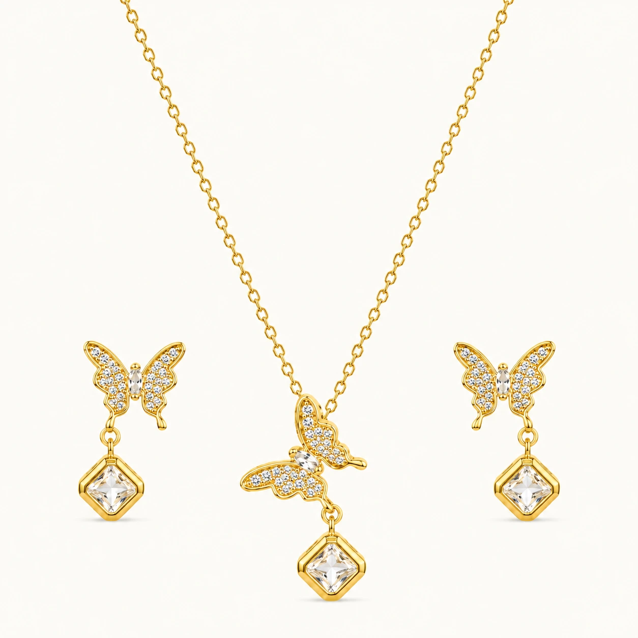 FlutterAura Butterfly Jewelry Set with sparkling butterfly pendant, geometric crystal drop, matching butterfly earrings, and polished gold finish