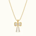Gold Bow Drop Pendant Necklace with sparkling round-cut stones and elegant dangling gemstone tassels in polished yellow gold finish
