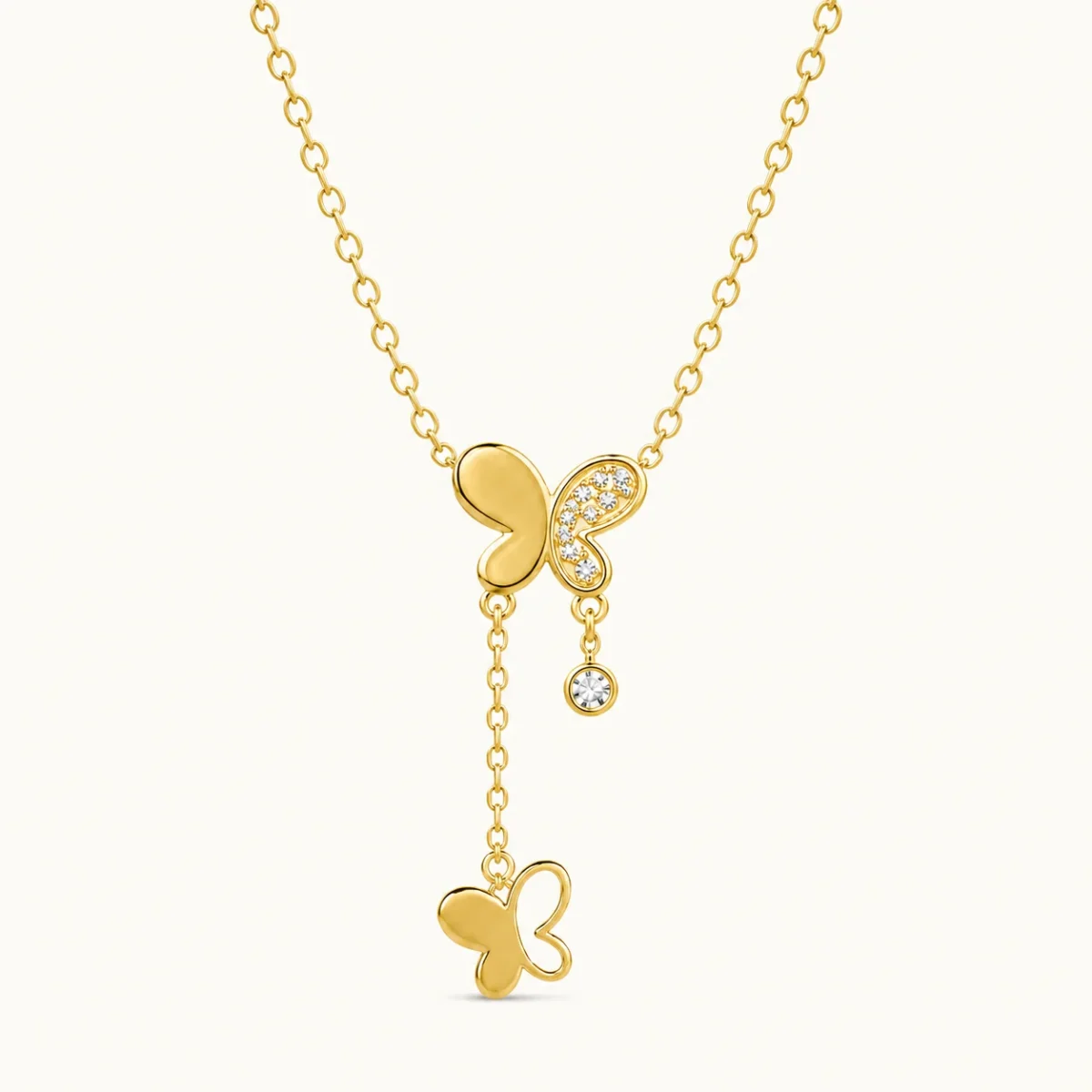 Gold Butterfly Drop Necklace with cubic zirconia butterfly wing, dangling crystal accent, and cascading butterfly charm