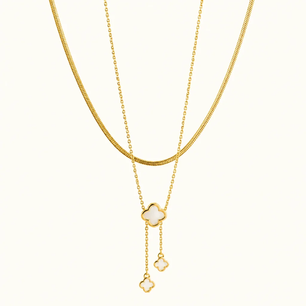 Gold Clover Layered Drop Necklace with mother of pearl clover pendants, double-layer chain, and elegant cascading drop accents