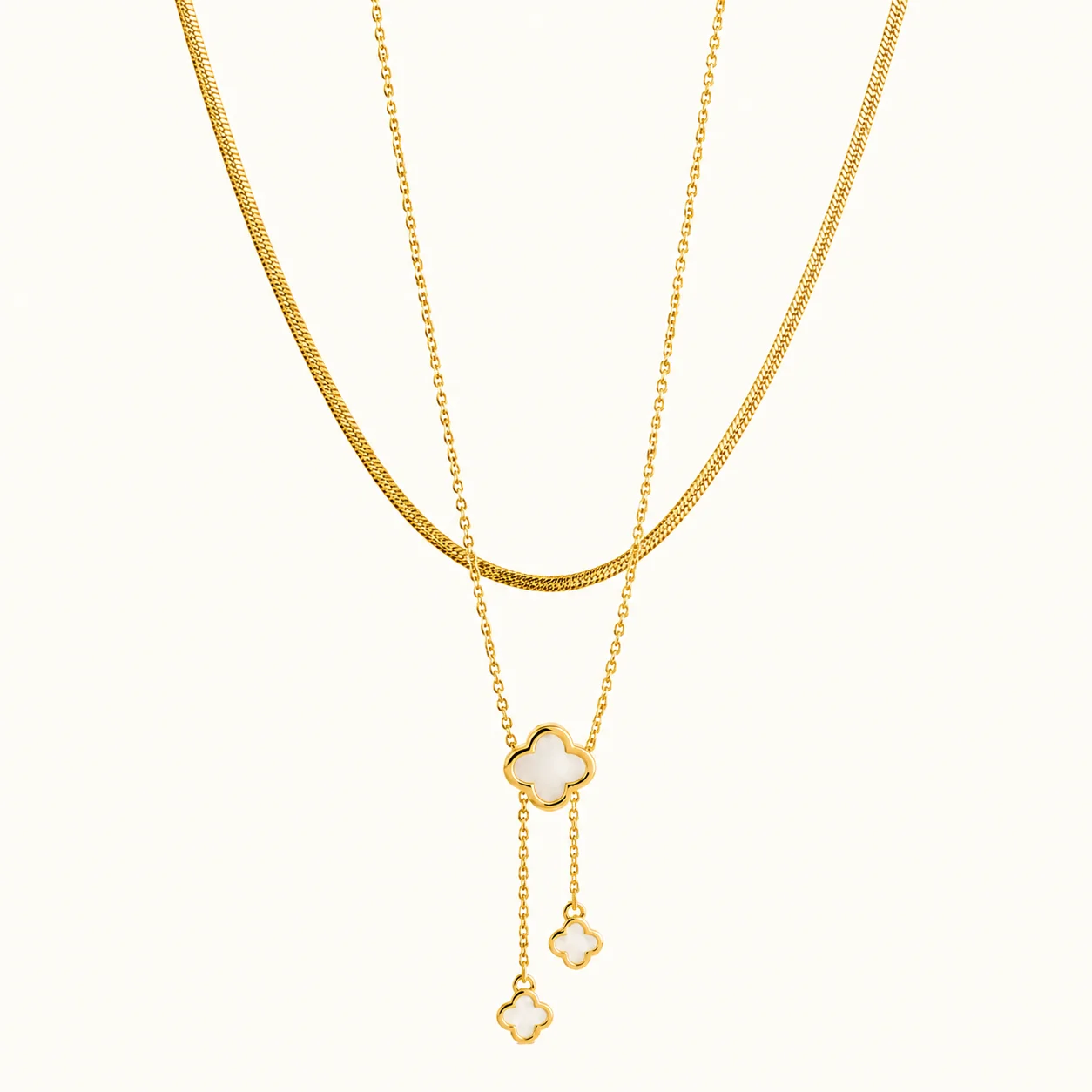 Gold Clover Layered Drop Necklace with mother of pearl clover pendants, double-layer chain, and elegant cascading drop accents