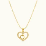 Gold Heart Charm Pendant Necklace with sparkling pavé stones and dangling circular charm in polished yellow gold finish