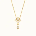 Mother of Pearl Flower Drop Necklace in yellow gold featuring a four-petal floral design with mother of pearl inlay and a pear-shaped sparkling stone drop