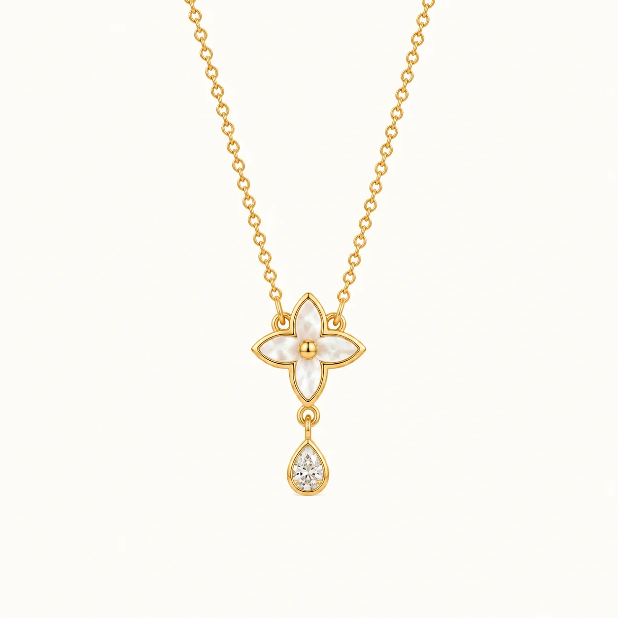 Mother of Pearl Flower Drop Necklace in yellow gold featuring a four-petal floral design with mother of pearl inlay and a pear-shaped sparkling stone drop