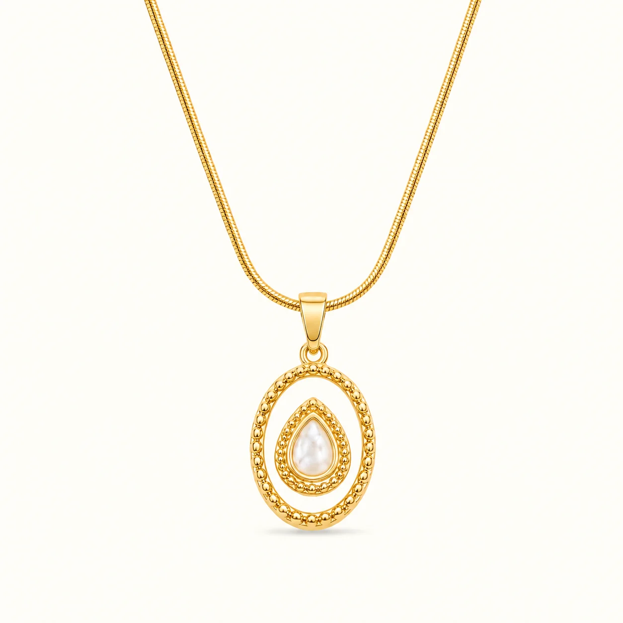 Pear Shape Pearl Gold Pendant Necklace featuring a white pear-shaped pearl centerpiece within an ornate oval gold frame with beaded detailing