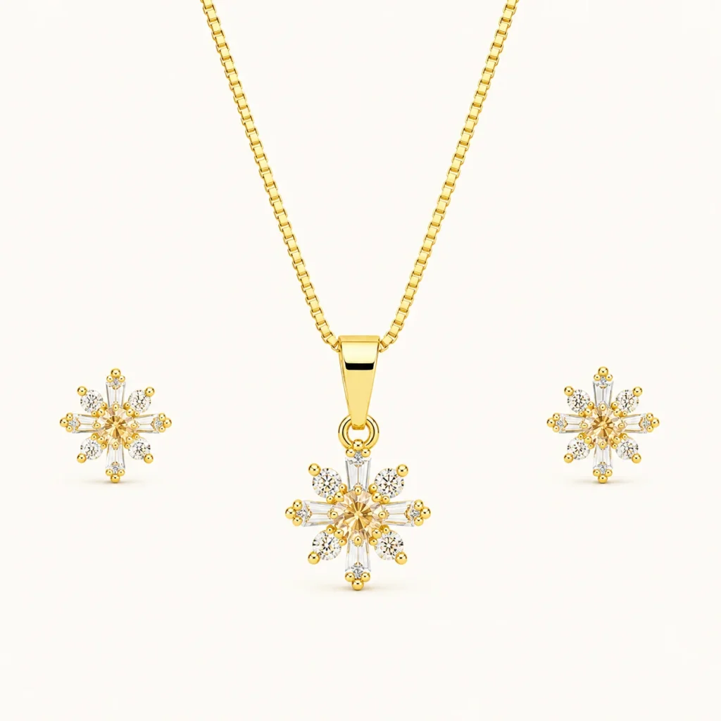 Snowflake Crystal Jewelry Set featuring a gold pendant necklace and matching stud earrings with champagne center stones and sparkling round and baguette crystals