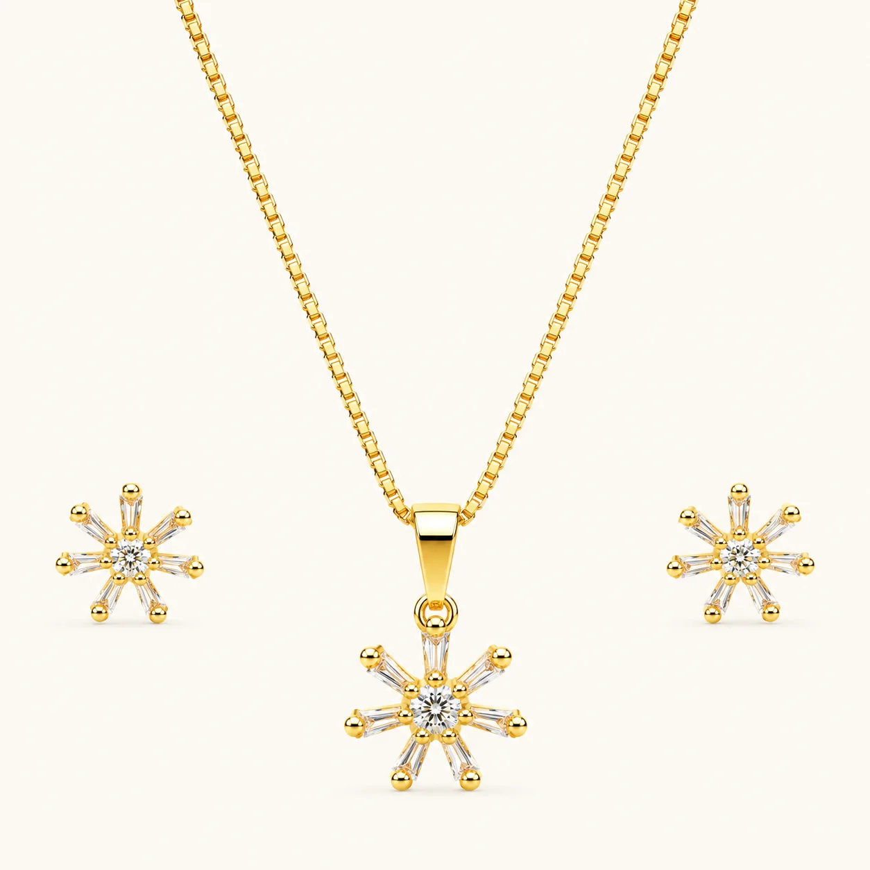Sunburst CZ Jewelry Set in gold finish featuring a radiant cubic zirconia pendant with baguette-cut rays and matching stud earrings.