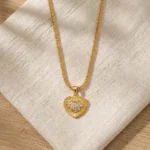 Divayra Aurelia Sunburst Heart Popcorn Chain Necklace with textured gold-tone pendant and clear pavé CZ centre
