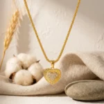 Divayra Aurelia Sunburst Heart Popcorn Chain Necklace with textured gold-tone pendant and clear pavé CZ centre