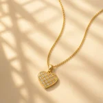 Divayra Avelisse Quilted Heart Box Chain Necklace with clear CZ stones and a polished gold-tone lattice pendant (6)