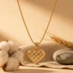 Divayra Avelisse Quilted Heart Box Chain Necklace with clear CZ stones and a polished gold-tone lattice pendant (6)