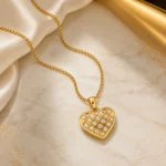 Divayra Avelisse Quilted Heart Box Chain Necklace with clear CZ stones and a polished gold-tone lattice pendant (6)