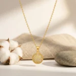 Divayra Celeste Pave Sphere Cable Chain Necklace with clear CZ crystal ball pendant and delicate gold-tone oval links