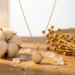 Divayra Celeste Pave Sphere Cable Chain Necklace with clear CZ crystal ball pendant and delicate gold-tone oval links