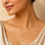 Divayra Seraphine Pave Open Heart Cable Chain Necklace with clear CZ stones and polished gold-tone oval links