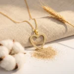 Divayra Seraphine Pave Open Heart Cable Chain Necklace with clear CZ stones and polished gold-tone oval links