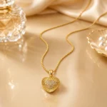 Divayra Solara Radiant Heart Box Chain Necklace with sunburst-textured gold-tone pendant and clear pavé CZ heart centre