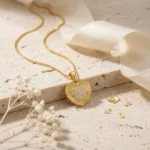 Divayra Solara Radiant Heart Box Chain Necklace with sunburst-textured gold-tone pendant and clear pavé CZ heart centre