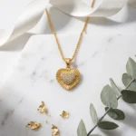 Divayra Solara Radiant Heart Box Chain Necklace with sunburst-textured gold-tone pendant and clear pavé CZ heart centre
