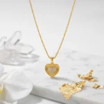 Divayra Solara Radiant Heart Box Chain Necklace with sunburst-textured gold-tone pendant and clear pavé CZ heart centre