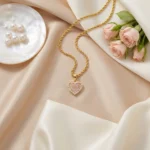 Pink CZ Heart Rope Chain Necklace with pink pavé stones, clear CZ halo and textured gold-tone twisted chain