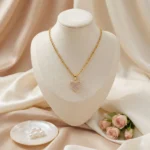 Pink CZ Heart Rope Chain Necklace with pink pavé stones, clear CZ halo and textured gold-tone twisted chain