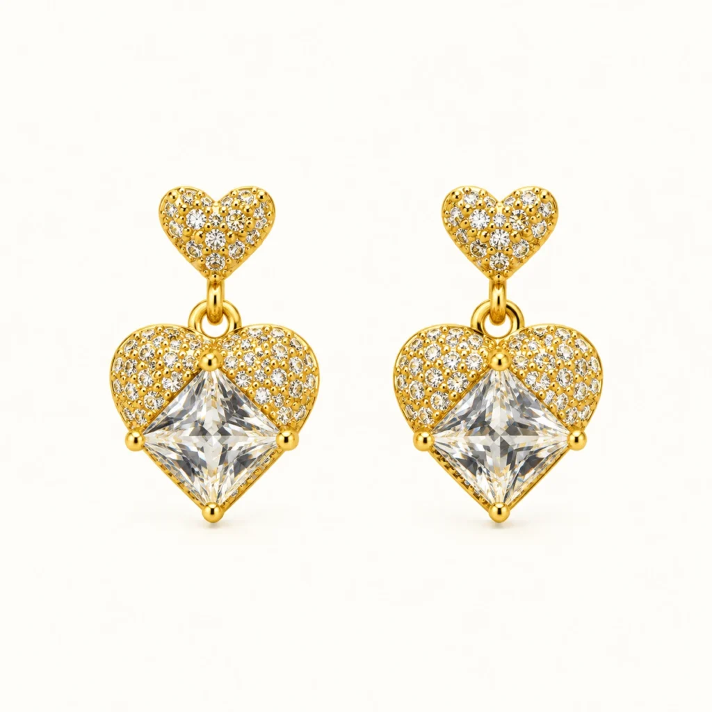 HeartLuxe Crystal Heart Earrings with sparkling clear stones, faceted heart-shaped centerpieces, and polished gold finish