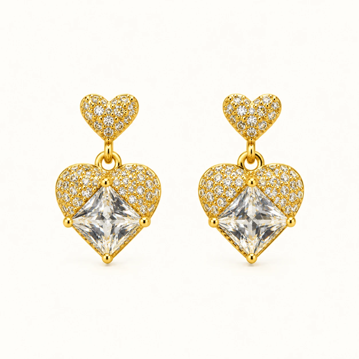 HeartLuxe Crystal Heart Earrings with sparkling clear stones, faceted heart-shaped centerpieces, and polished gold finish