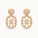Oval Crystal Drop Earrings featuring a pavé round stud top and an openwork oval medallion with radial spokes and a central oval crystal in a gold finish