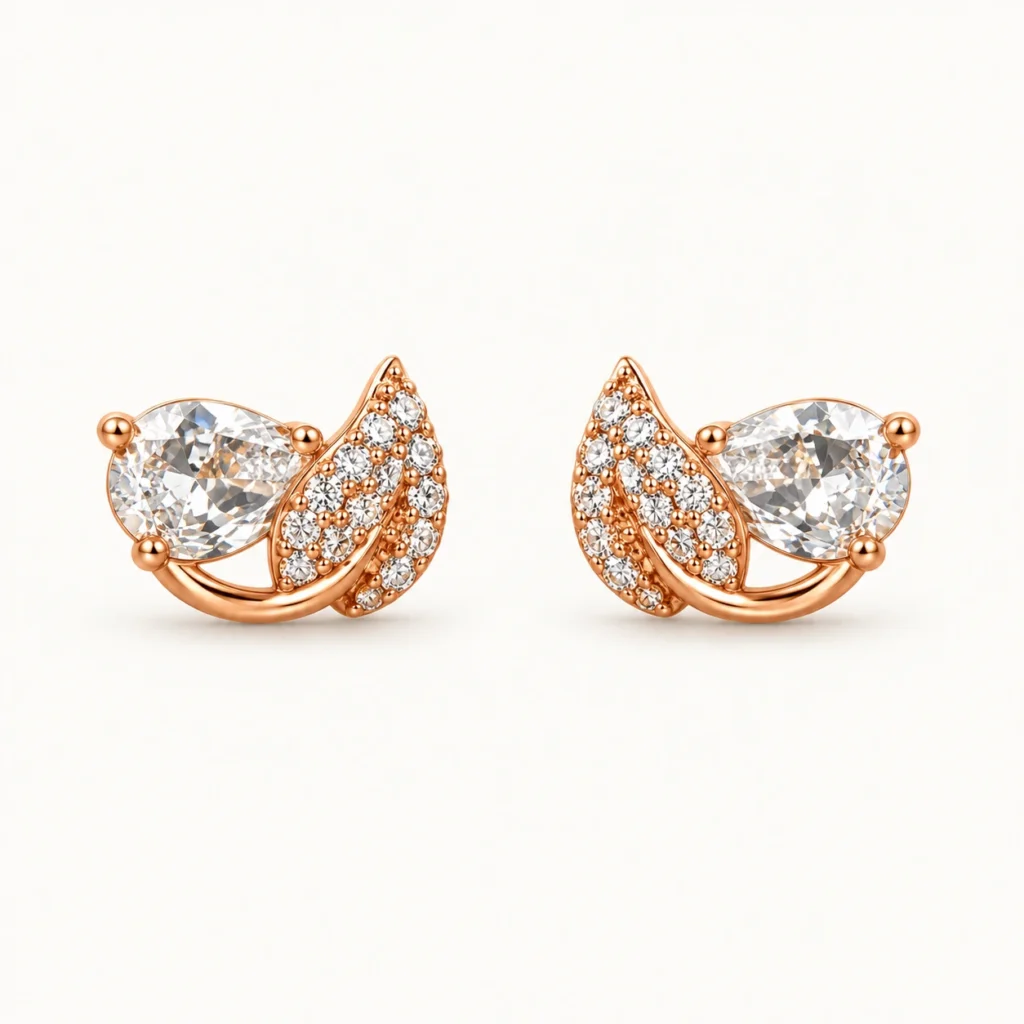 Pear Crystal Leaf Stud Earrings featuring a prong-set teardrop crystal and a curved micro-pavé leaf design